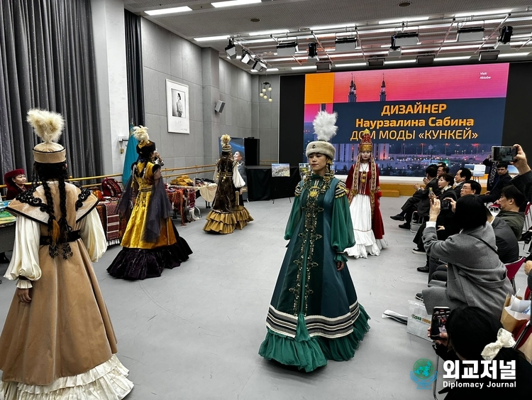 As a side event, Kazakhstan models showcase the country’s traditional clothing.