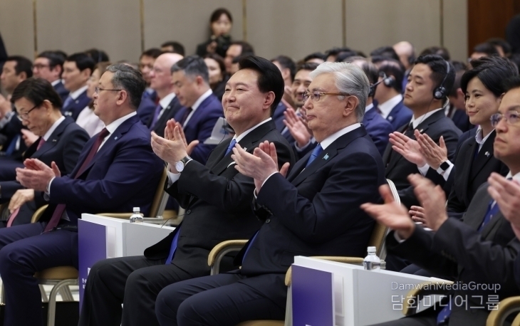South Korean President Yoon Suk-yeol and Kazakhstan President Kassym-Jomart K. Tokayev clap during the 'South Korea-Kazakhstan Business Forum' held at the Hilton Astana Hotel in Astana, Kazakhstan, on June 12.